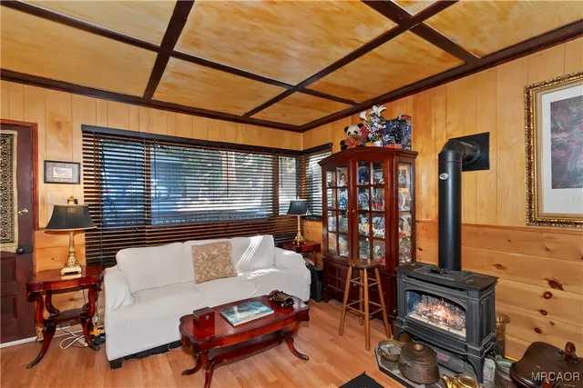 a living room with furniture a rug and a window