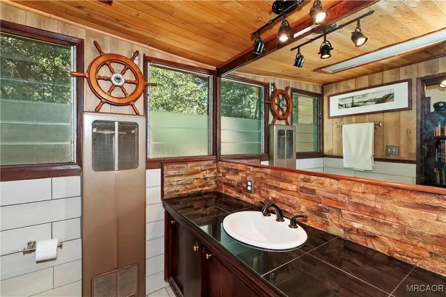 a bathroom with a sink and a mirror