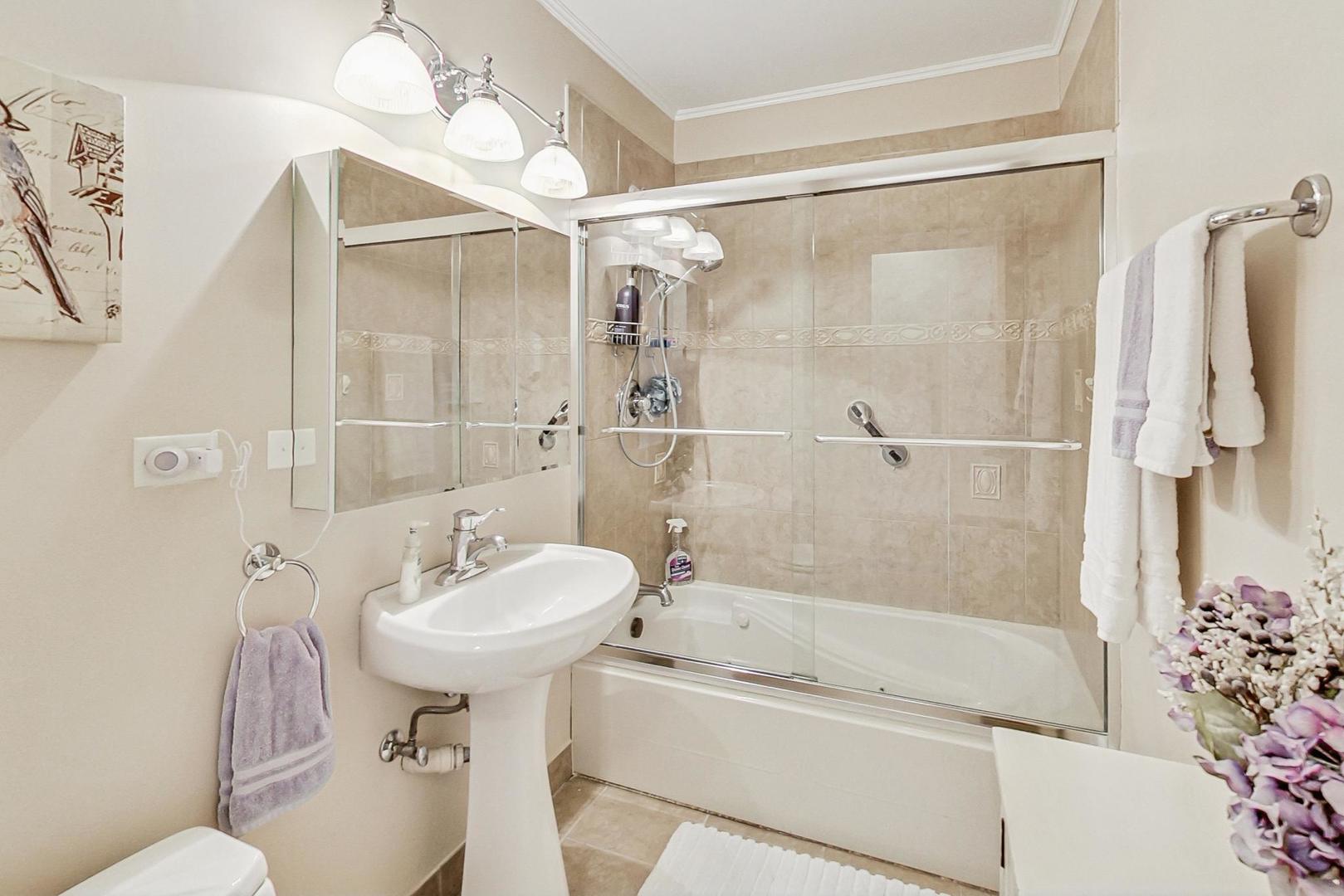 1016 Midway Road Northbrook, IL 60062 - Photo 14 of 27 a bathroom with a sink toilet and shower