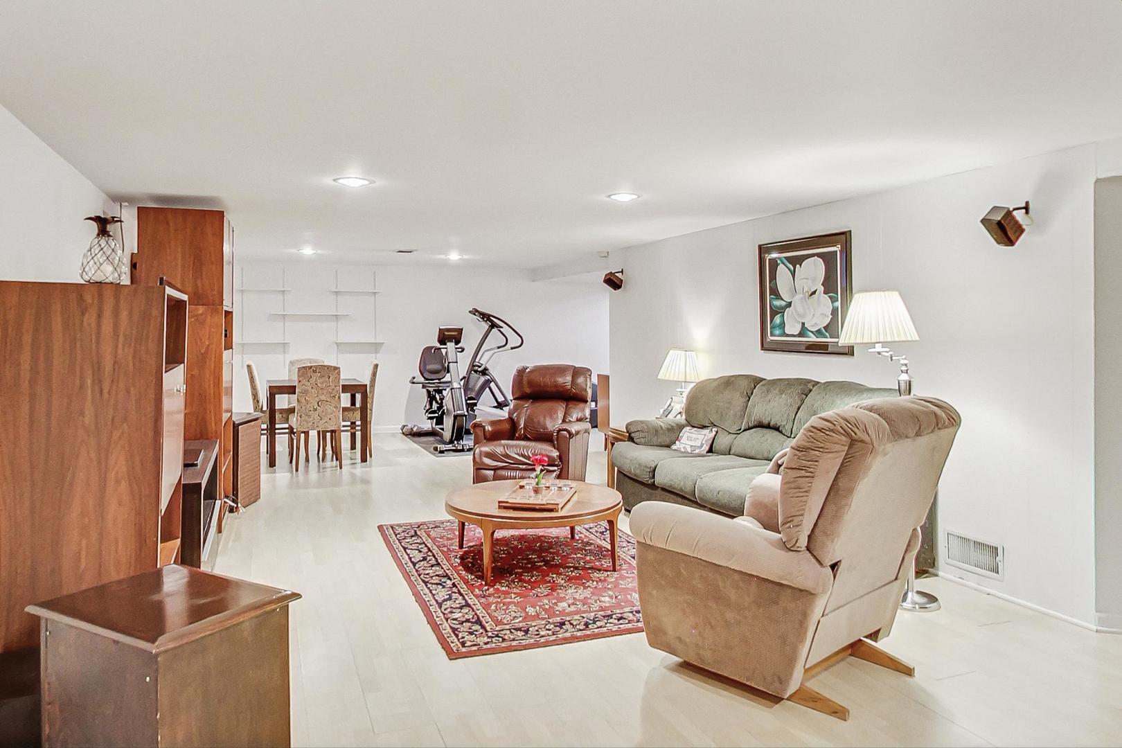 1016 Midway Road Northbrook, IL 60062 - Photo 16 of 27 a living room with furniture and a view of kitchen