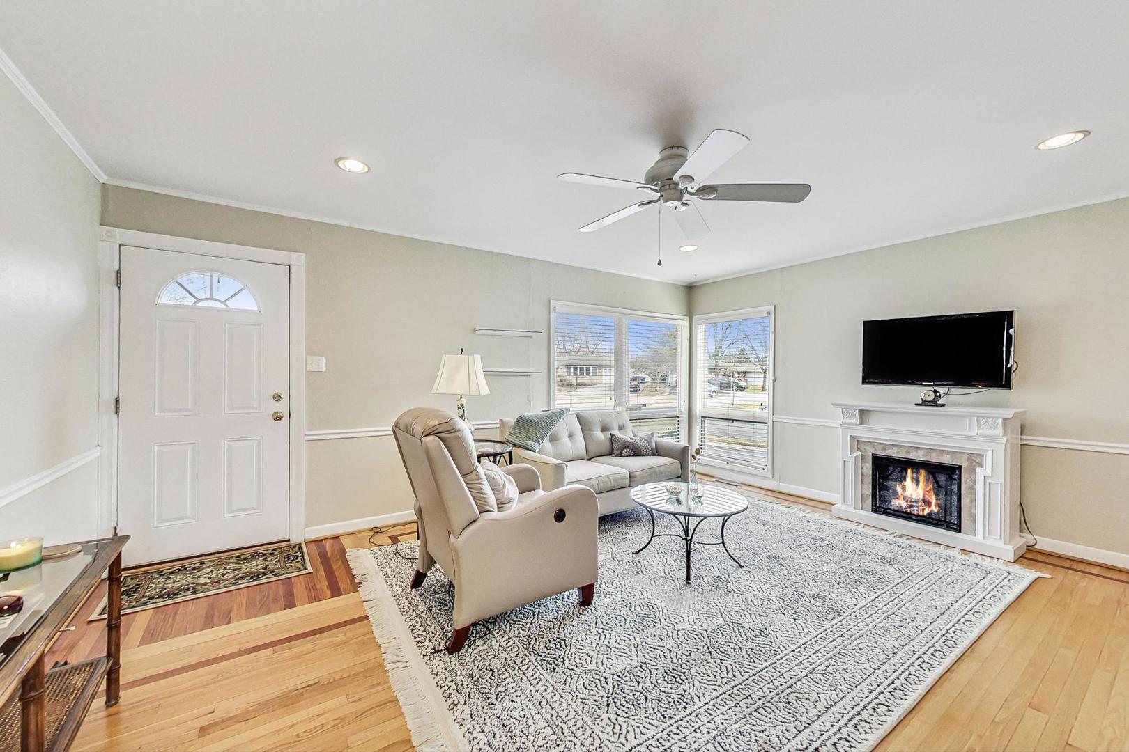 1016 Midway Road Northbrook, IL 60062 - Photo 2 of 27 a living room with furniture and a fireplace