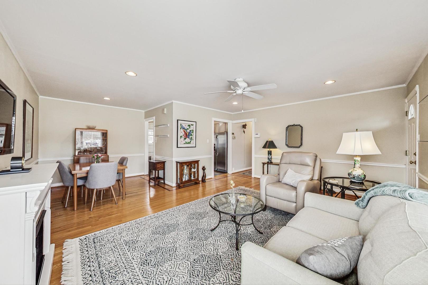 1016 Midway Road Northbrook, IL 60062 - Photo 4 of 27 a living room with furniture kitchen view and a wooden floor