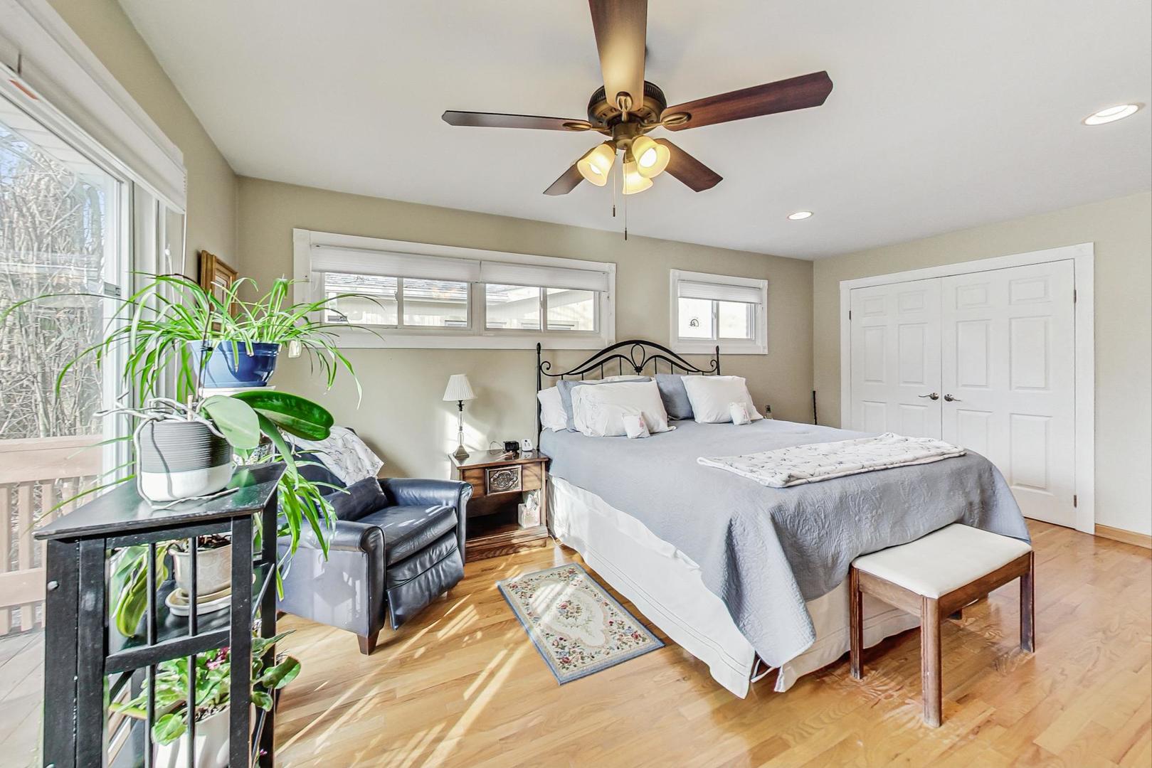 1016 Midway Road Northbrook, IL 60062 - Photo 10 of 27 a bedroom with a bed and a chandelier