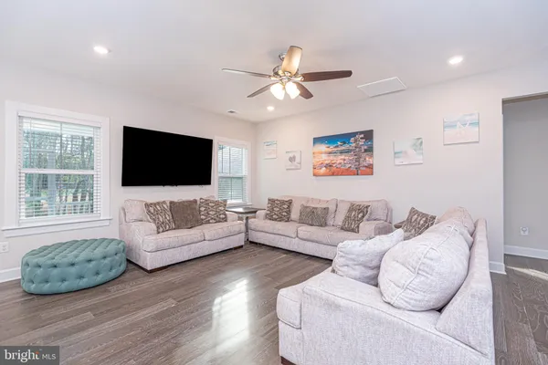 a large kitchen with kitchen island a sink stove and refrigerator