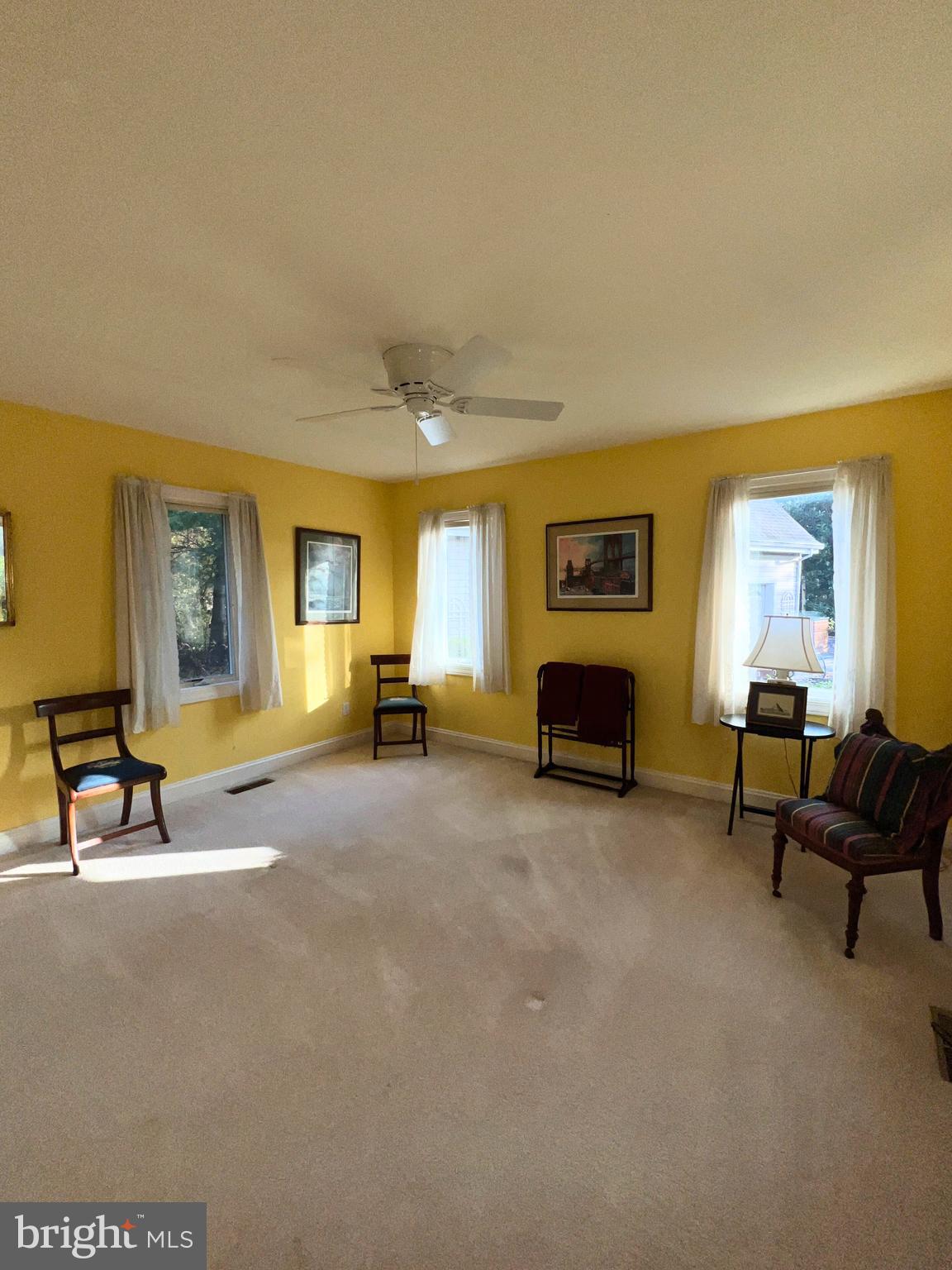 28701 Edgemere Road Easton, MD 21601 - Photo 11 of 39 a living room with furniture and a fireplace