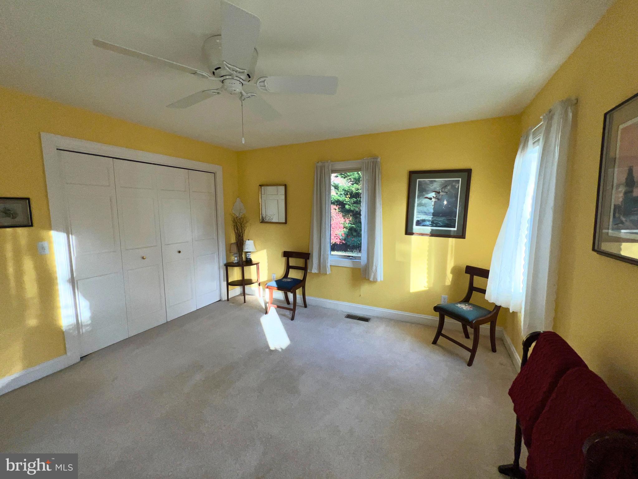 28701 Edgemere Road Easton, MD 21601 - Photo 12 of 39 a view of a livingroom with couch and a ceiling fan