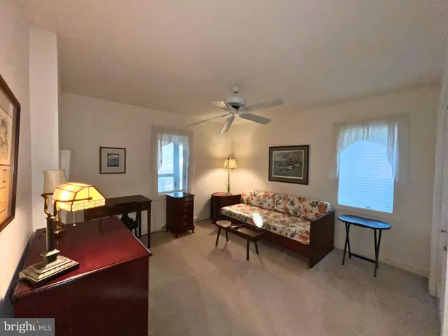 a living room with furniture and window