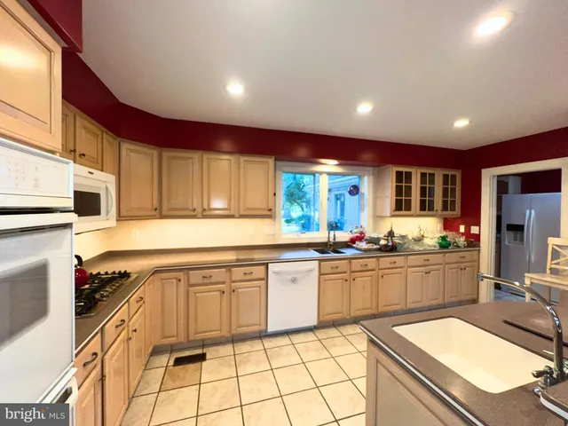 a kitchen with sink cabinets and stove