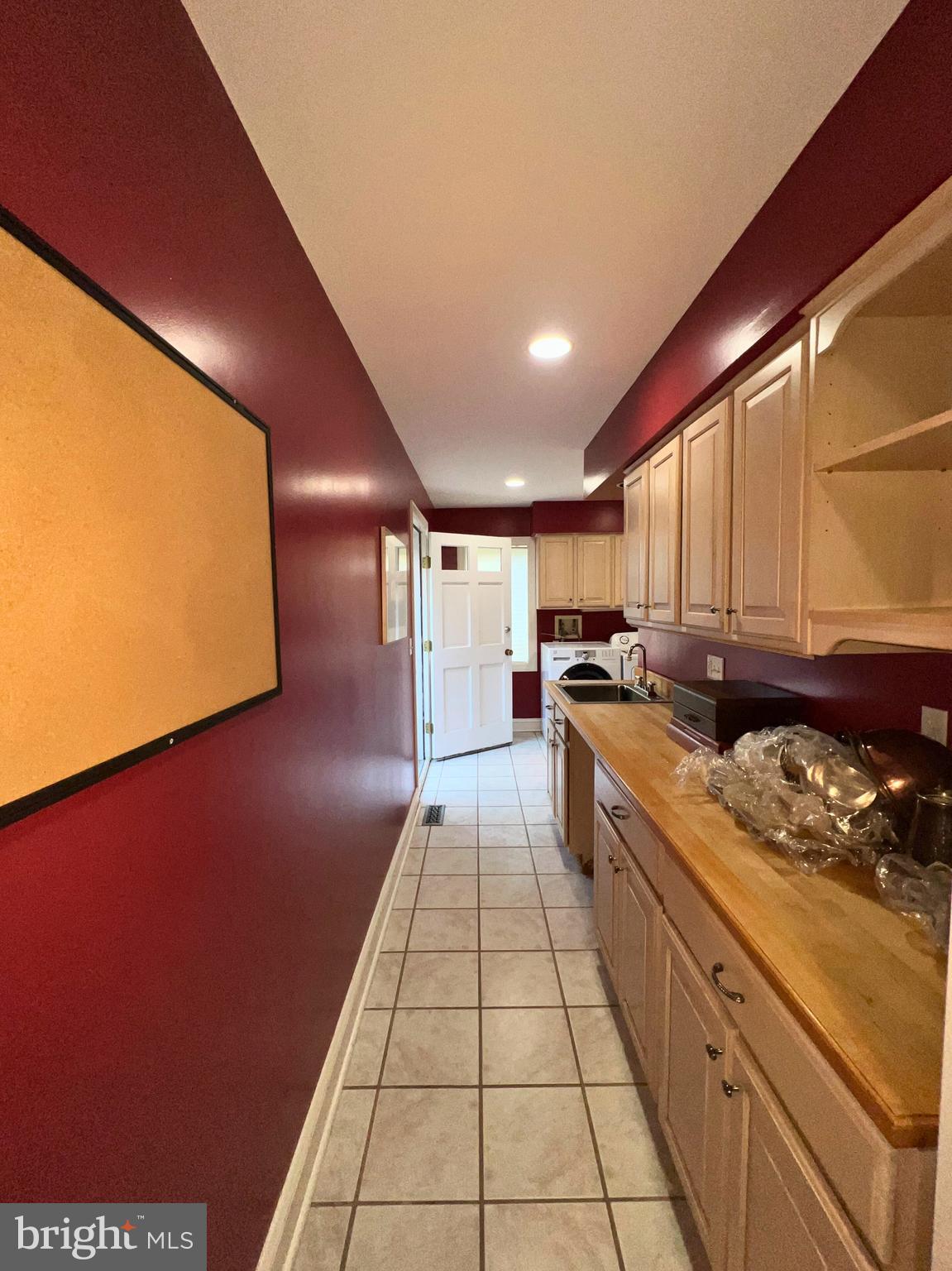 28701 Edgemere Road Easton, MD 21601 - Photo 22 of 39 a large kitchen with stainless steel appliances granite countertop a sink a stove counter space and cabinets