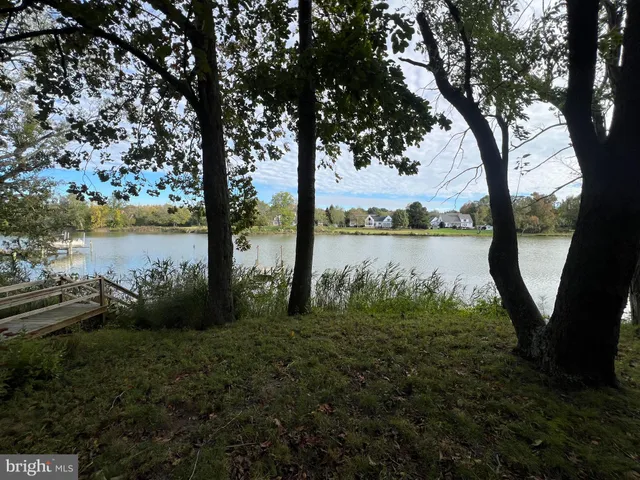 a view of a lake with a big yard