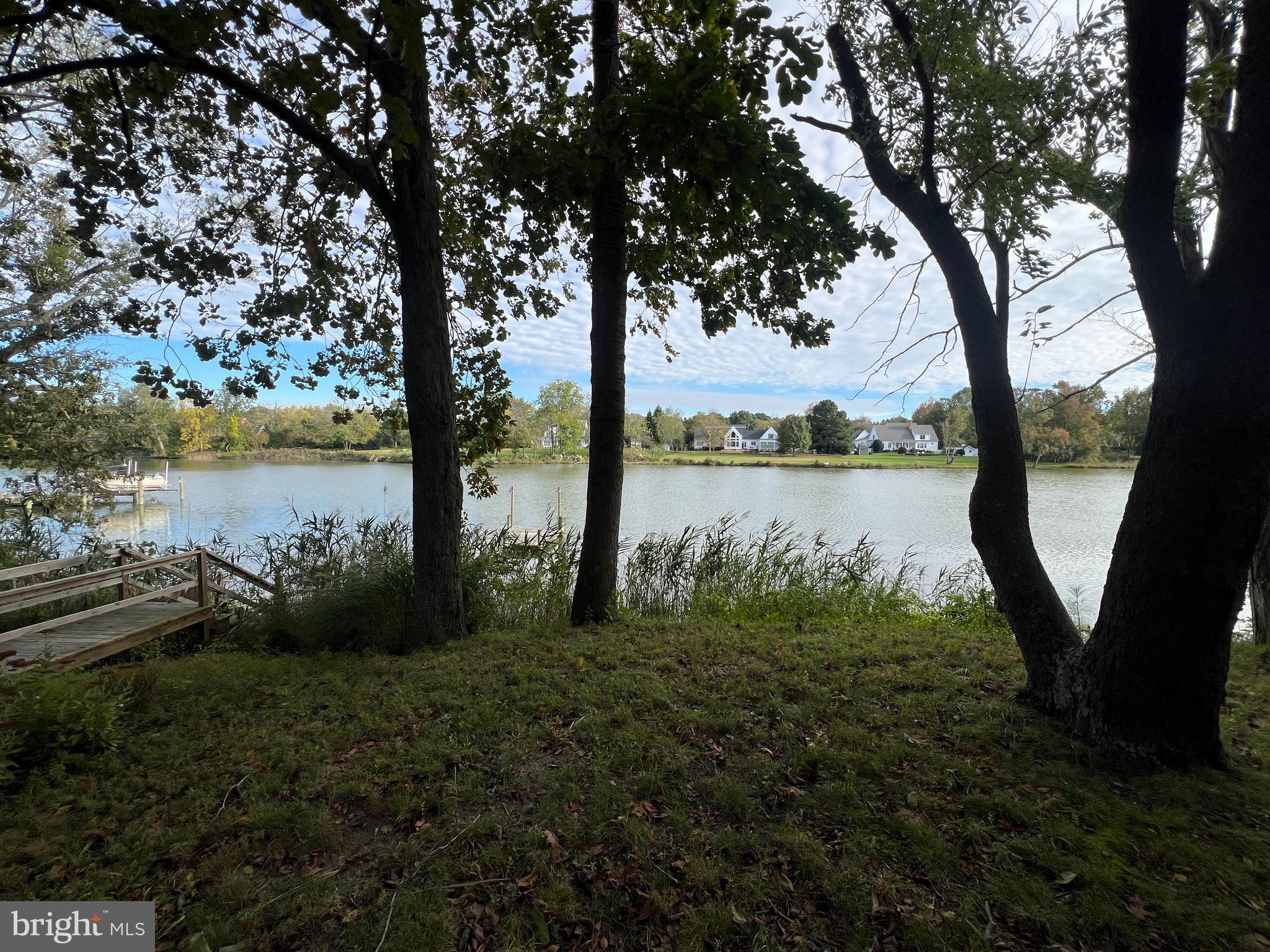 28701 Edgemere Road Easton, MD 21601 - Photo 33 of 39 a view of a lake with a big yard