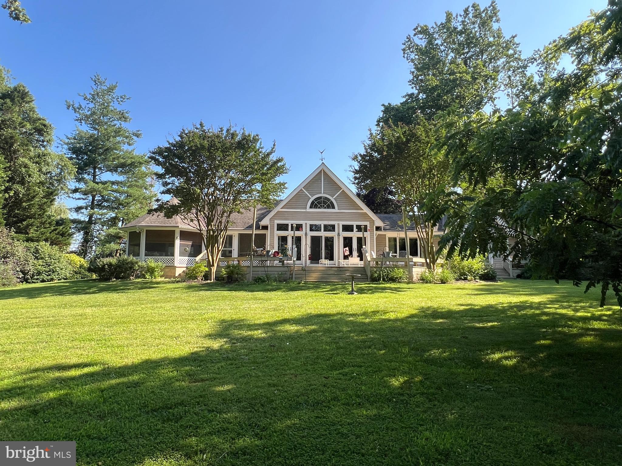 28701 Edgemere Road Easton, MD 21601 - Photo 6 of 39 a front view of a house with a garden