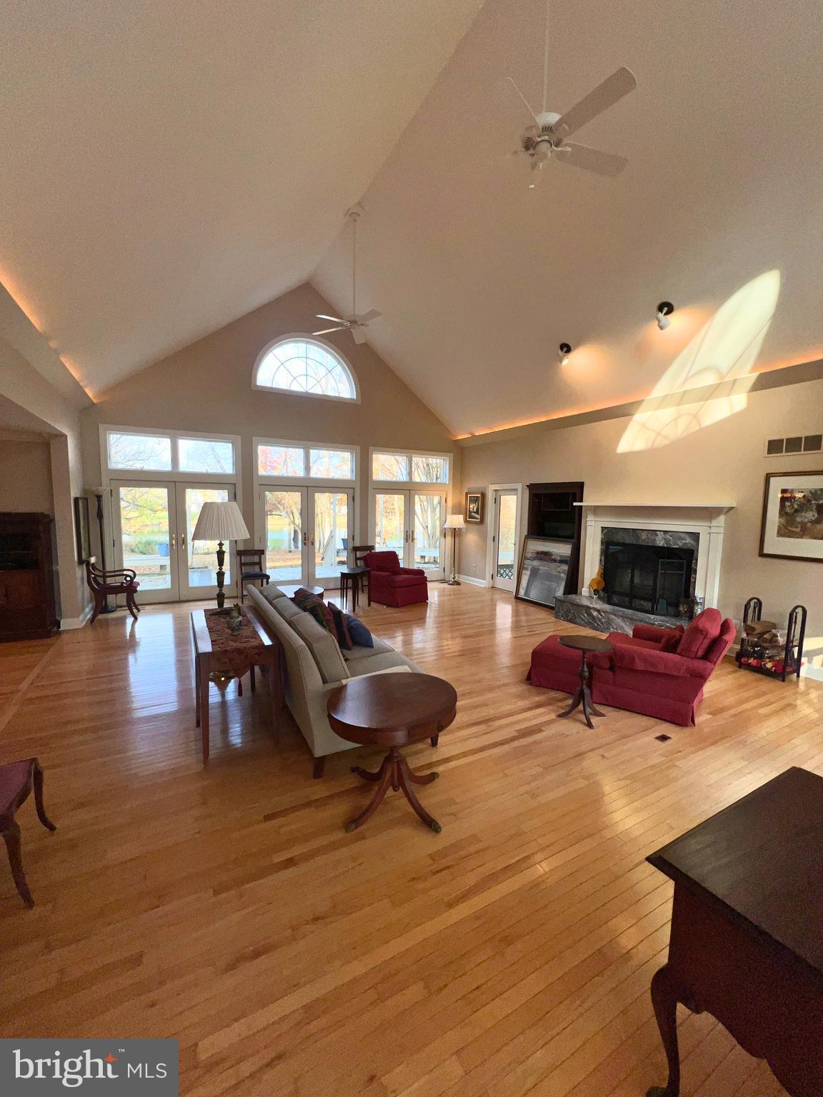 28701 Edgemere Road Easton, MD 21601 - Photo 8 of 39 a living room with furniture and a flat screen tv