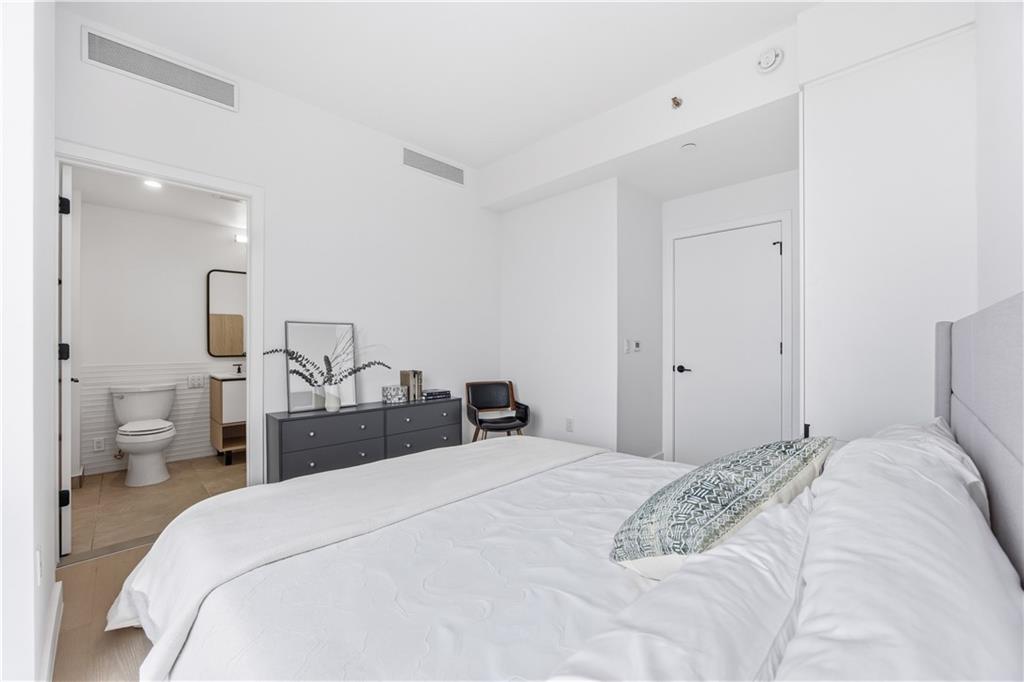 1807 66th Street, Unit 7B Brooklyn, NY 11204 - Photo 11 of 21 a bedroom with a bed and a lamp