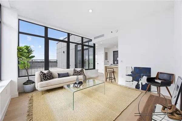 a living room with furniture and a large window