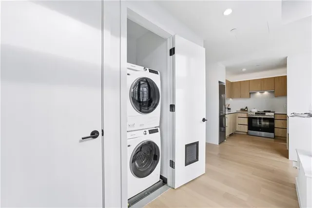 a view of a hallway with washer and dryer