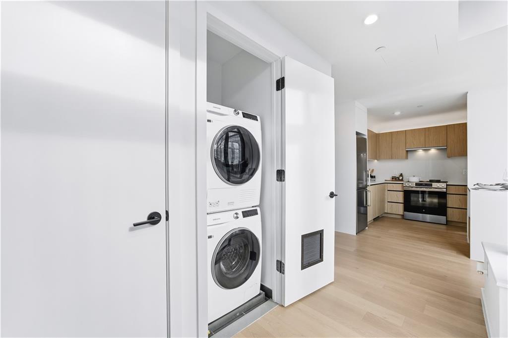 1807 66th Street, Unit 7B Brooklyn, NY 11204 - Photo 7 of 21 a view of a hallway with washer and dryer