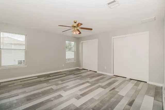 a kitchen that has a sink and a stove in it