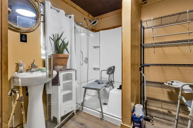 a bathroom with a sink and mirror