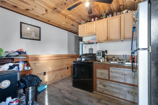 a kitchen with stainless steel appliances granite countertop a stove and a refrigerator