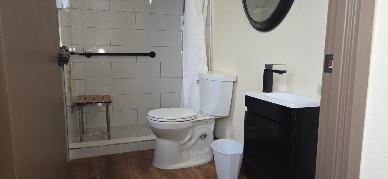 84 Pukihae Street, Unit PH6 Hilo, HI 96720 - Photo 20 of 29 a bathroom with a toilet and a mirror