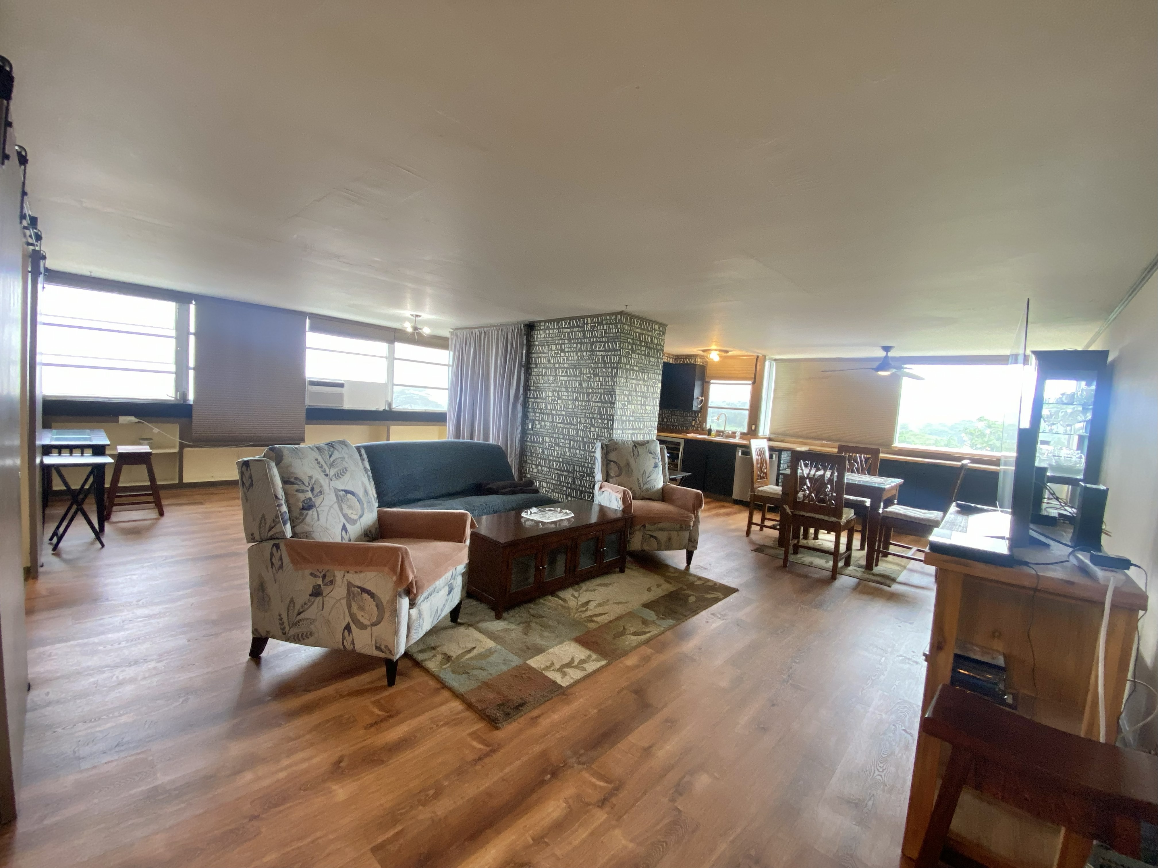 84 Pukihae Street, Unit PH6 Hilo, HI 96720 - Photo 21 of 29 a living room with furniture and wooden floor