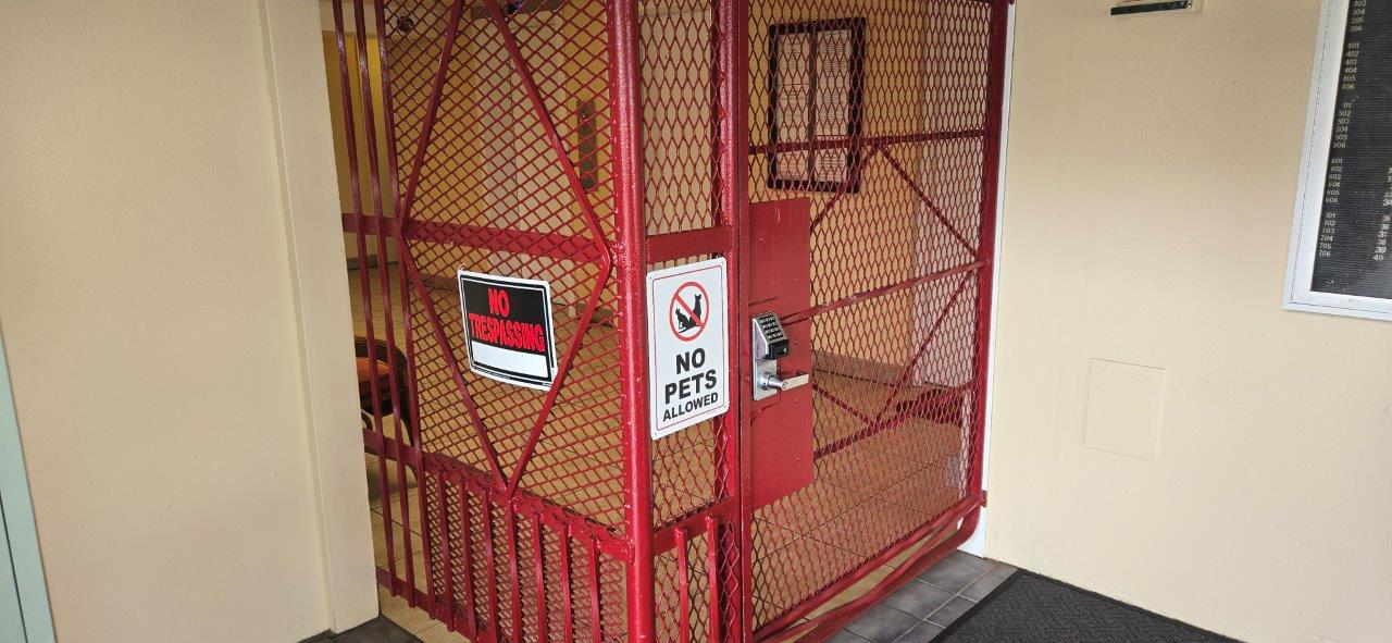 84 Pukihae Street, Unit PH6 Hilo, HI 96720 - Photo 23 of 29 a sign on a wall next to a building