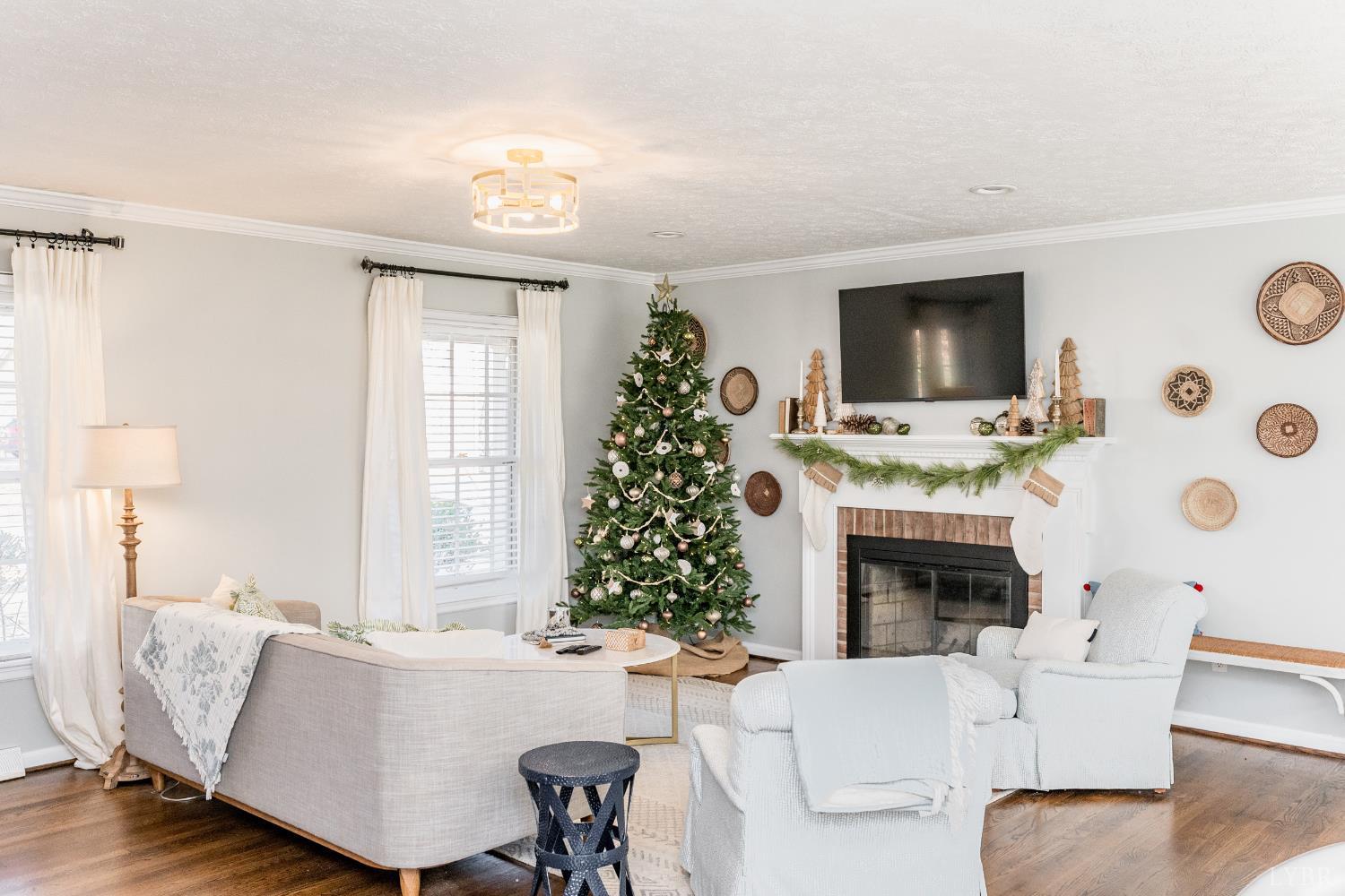 5152 Wedgewood Road Lynchburg, VA 24503 - Photo 13 of 70 a living room with furniture a flat screen tv and a fireplace