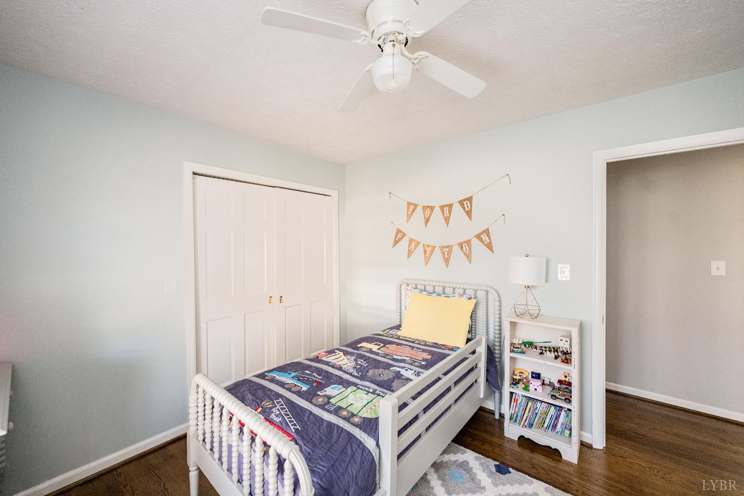 5152 Wedgewood Road Lynchburg, VA 24503 - Photo 18 of 70 a bedroom with a bed and a chandelier