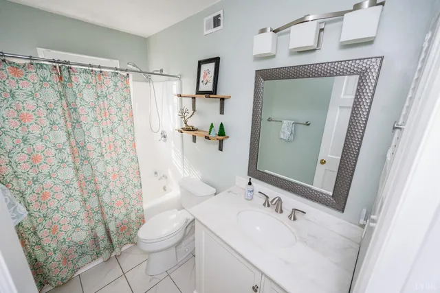 a living room with furniture flat screen tv and a fireplace