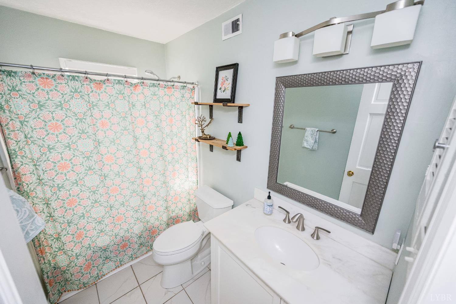5152 Wedgewood Road Lynchburg, VA 24503 - Photo 27 of 70 a bathroom with a sink toilet and shower