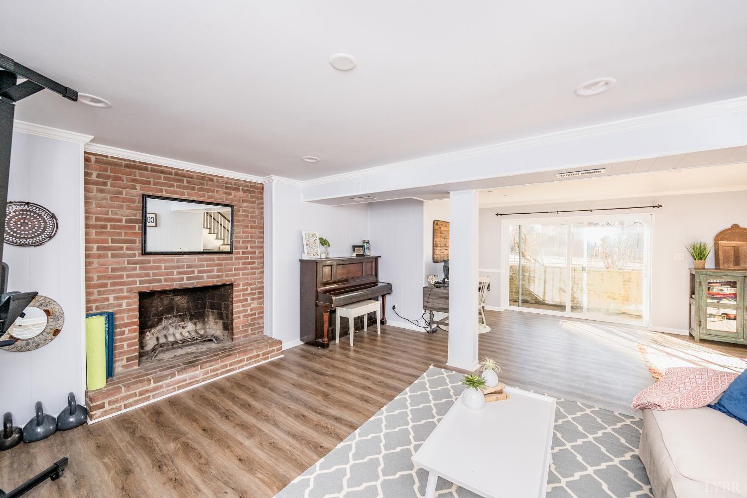 5152 Wedgewood Road Lynchburg, VA 24503 - Photo 34 of 70 a living room with furniture and a fireplace