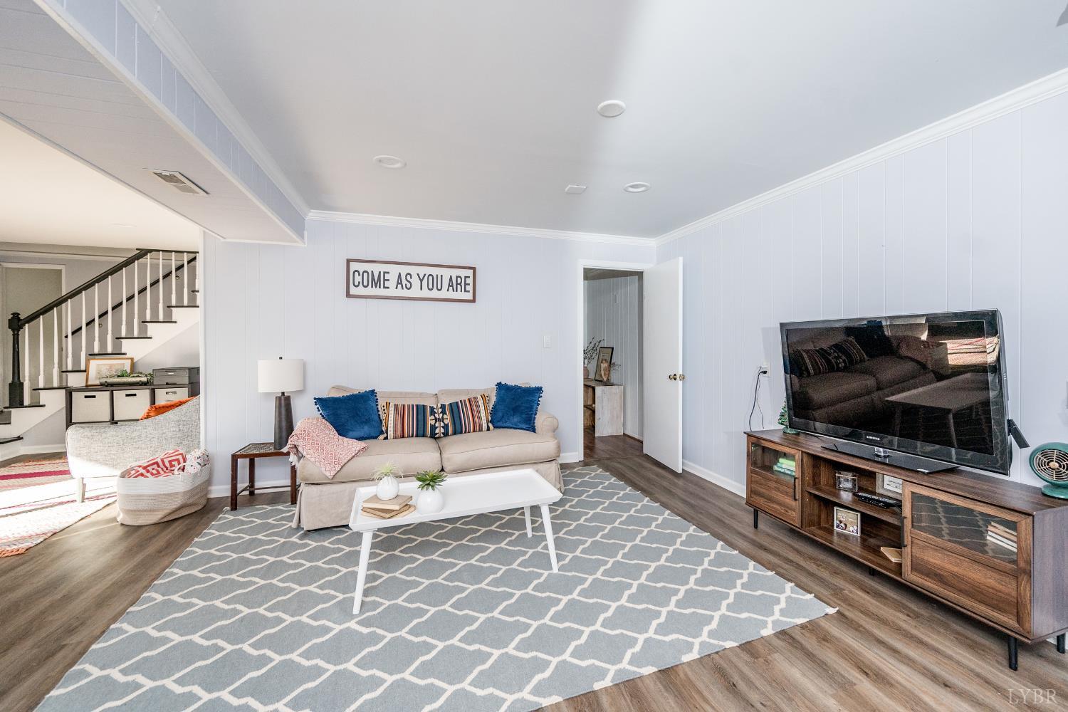 5152 Wedgewood Road Lynchburg, VA 24503 - Photo 35 of 70 a living room with furniture and a flat screen tv
