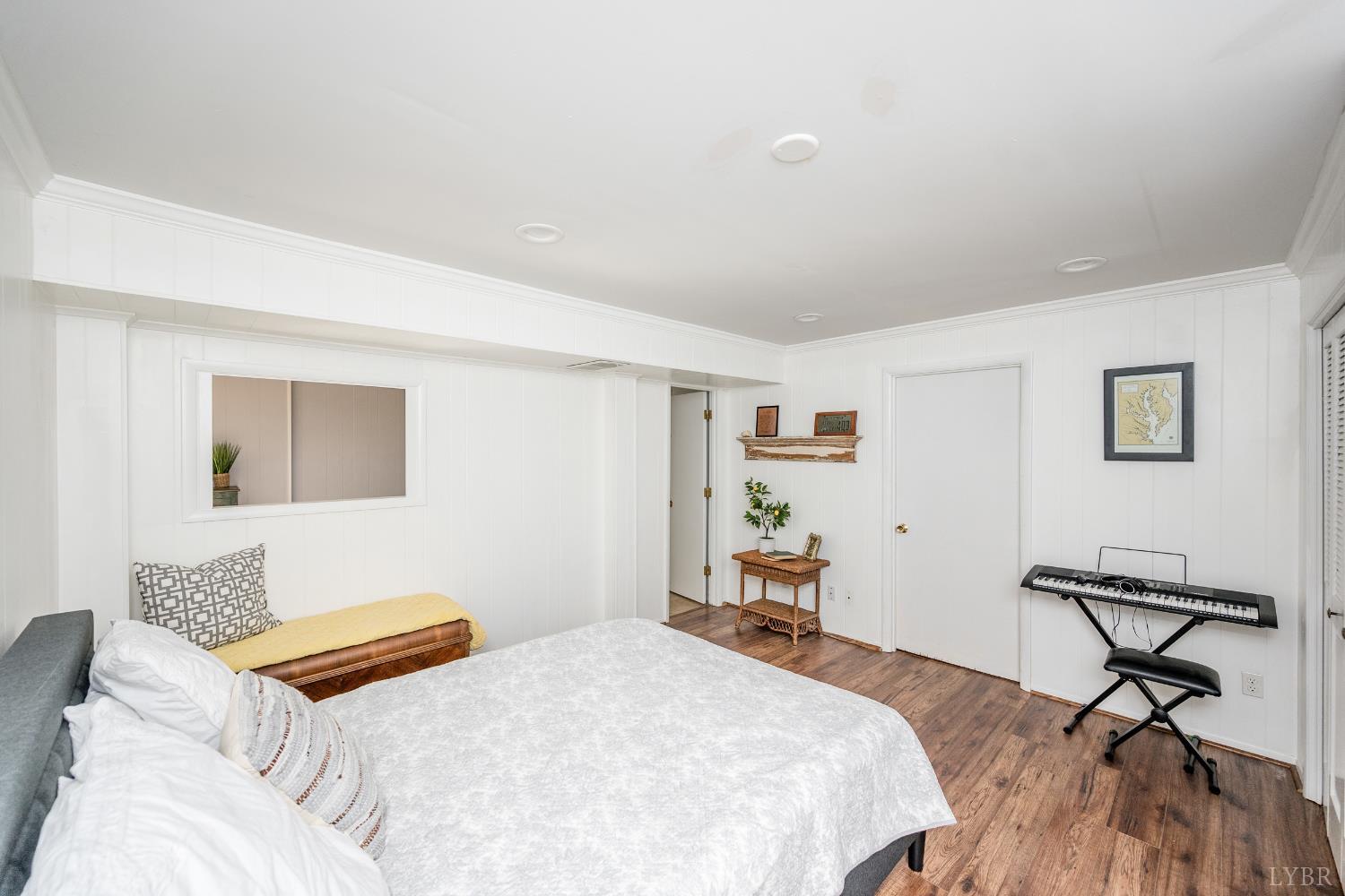 5152 Wedgewood Road Lynchburg, VA 24503 - Photo 36 of 70 a bedroom with a bed and wooden floor