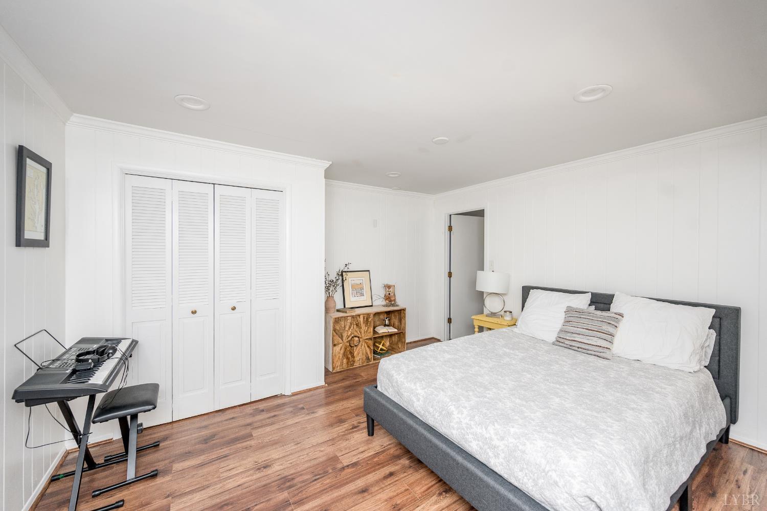 5152 Wedgewood Road Lynchburg, VA 24503 - Photo 37 of 70 a bedroom with a bed and wooden floor