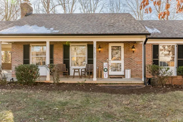 a view of a livingroom with wooden floor and a window