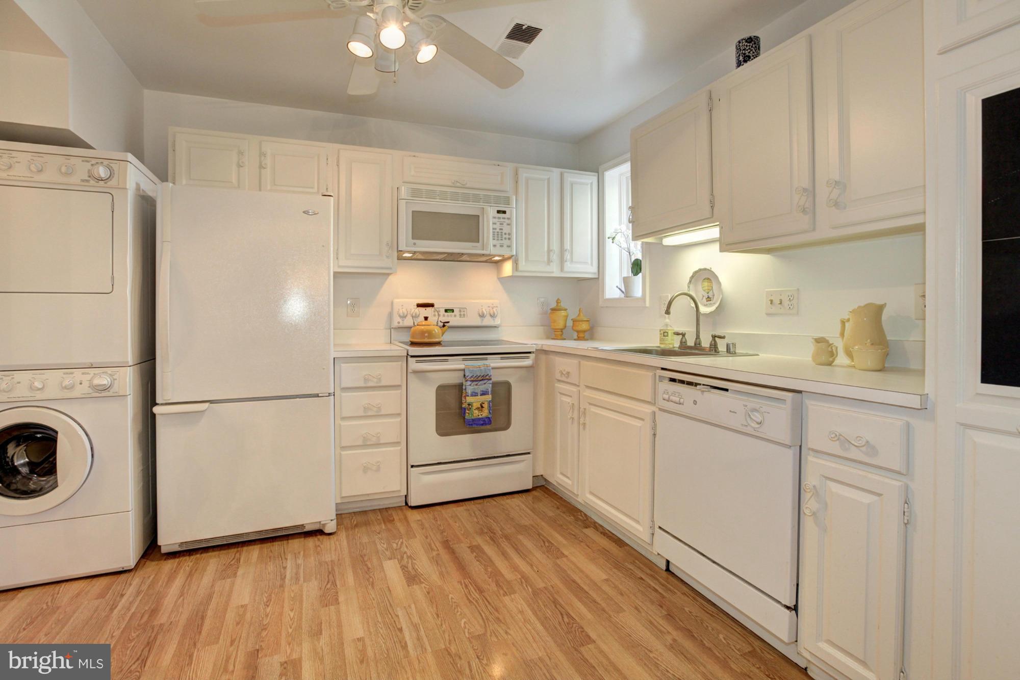 6637 Fairfax Road, Unit 105 Chevy Chase, MD 20815 - Photo 12 of 30 Kitchen with stackable washer/dryer