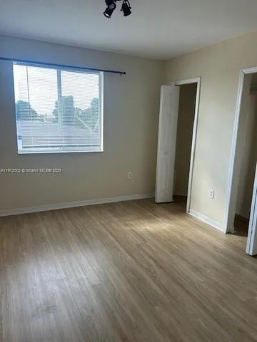 a bathroom with a bathtub a toilet and a shower