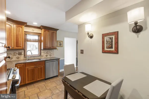 a open kitchen with a sink appliances and cabinets