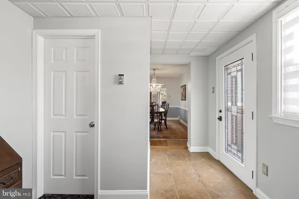 a view of a livingroom and a hallway