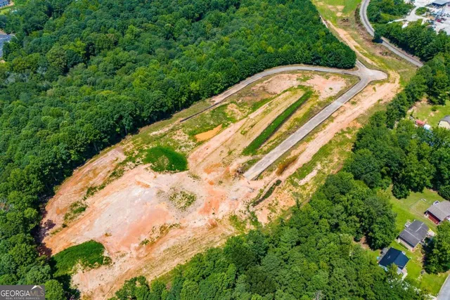 a view of a swimming pool with a yard