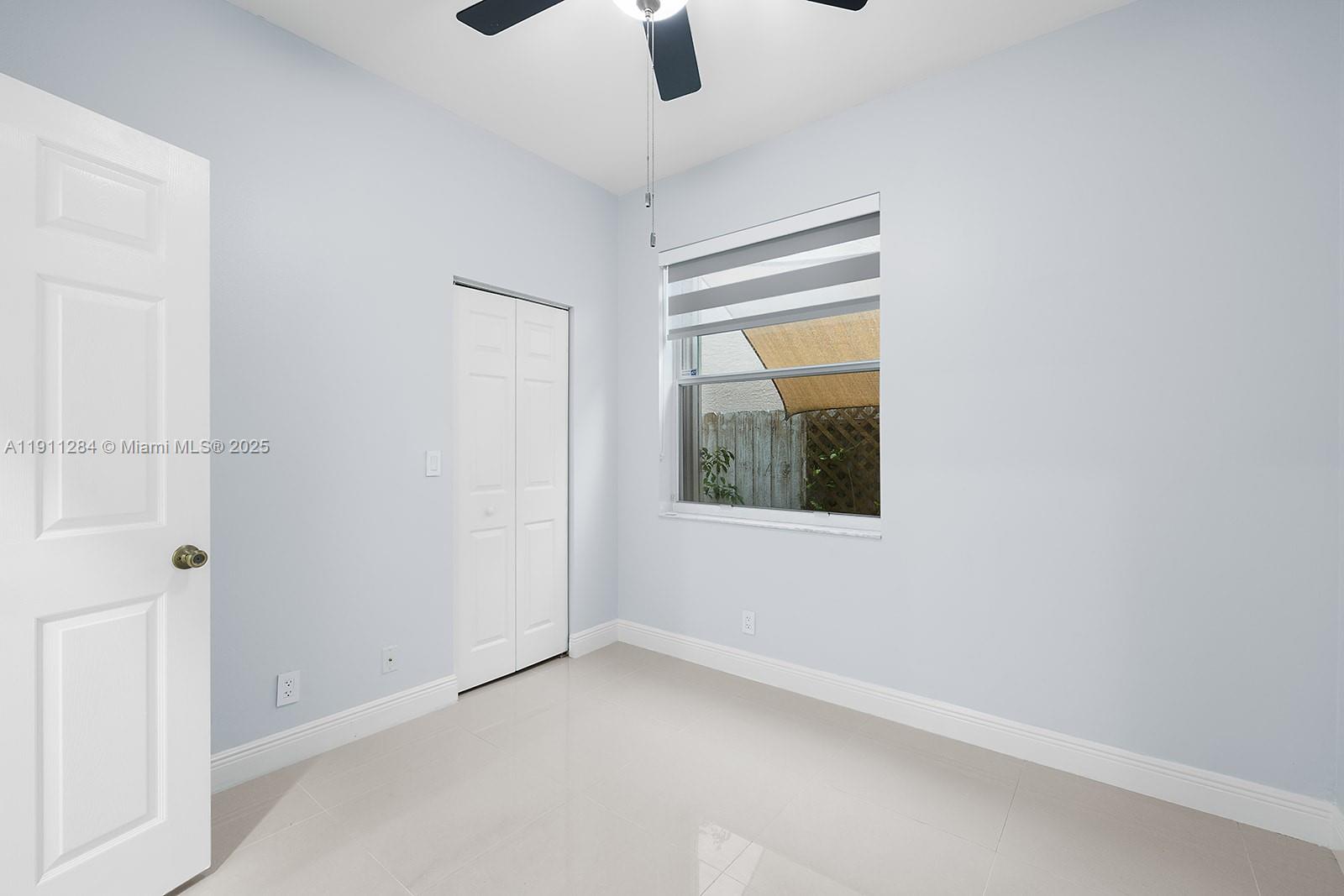 16296 Southwest 26th Street Miramar, FL 33027 - Photo 11 of 48 a view of an empty room with a window