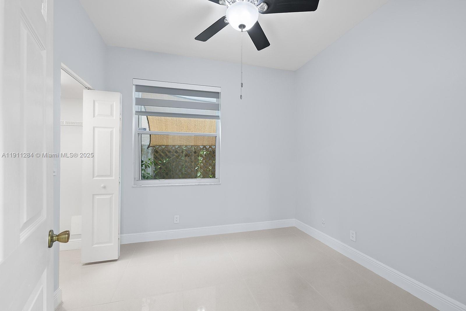 16296 Southwest 26th Street Miramar, FL 33027 - Photo 13 of 48 an empty room with a window