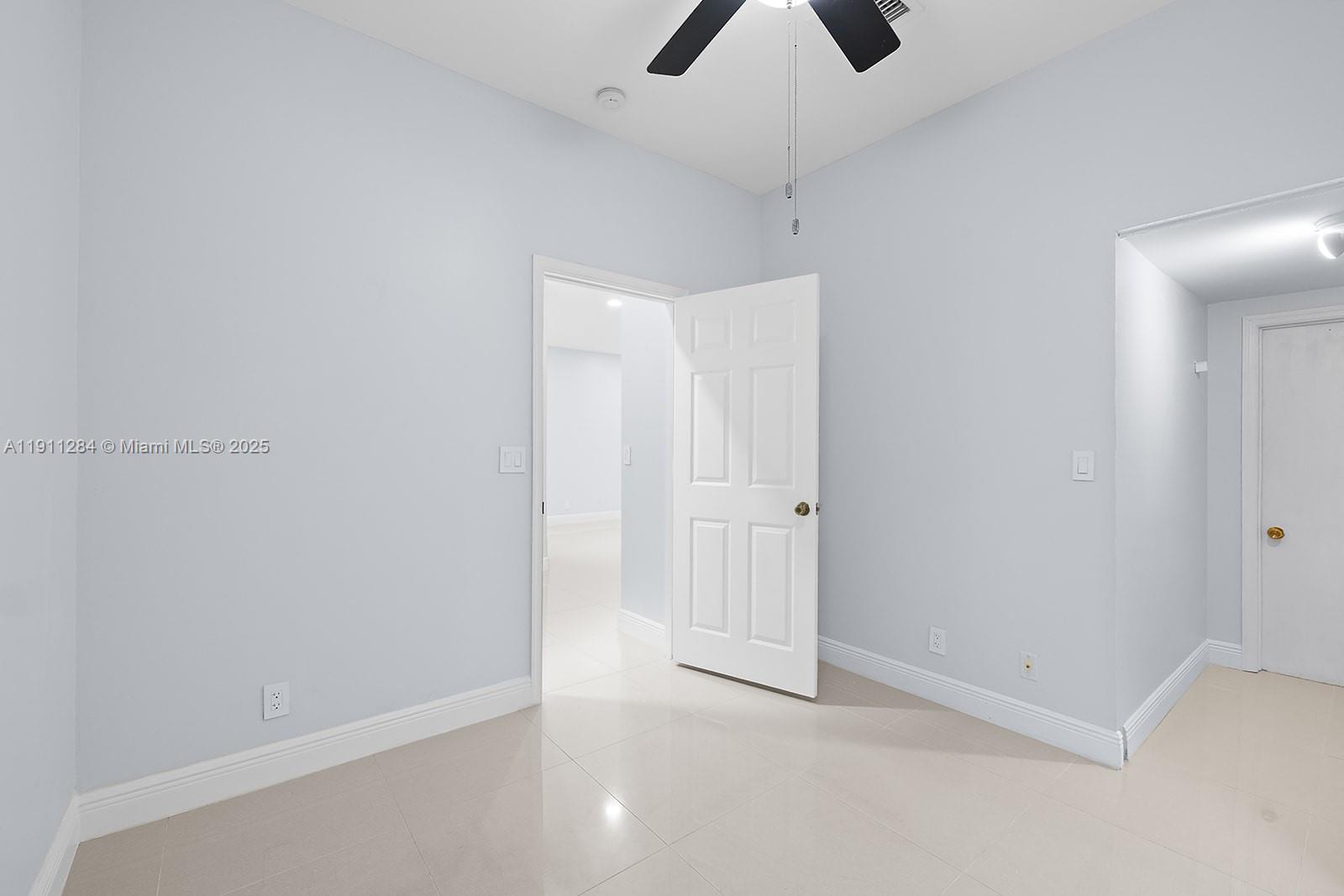 16296 Southwest 26th Street Miramar, FL 33027 - Photo 15 of 48 an empty room with chandelier fan