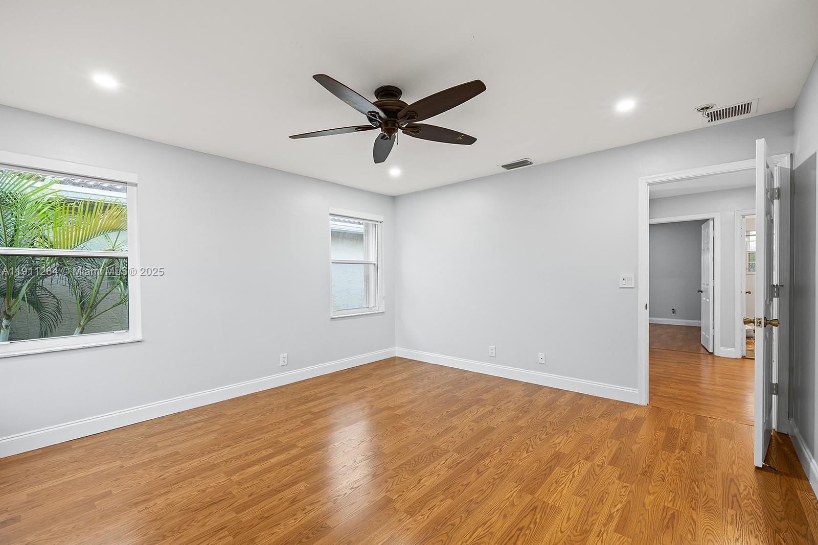 16296 Southwest 26th Street Miramar, FL 33027 - Photo 21 of 48 wooden floor in an empty room with a window