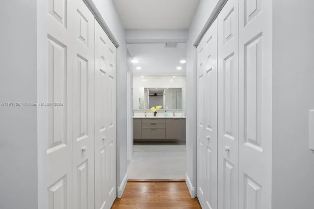 a bathroom with a double vanity sink mirror and shower