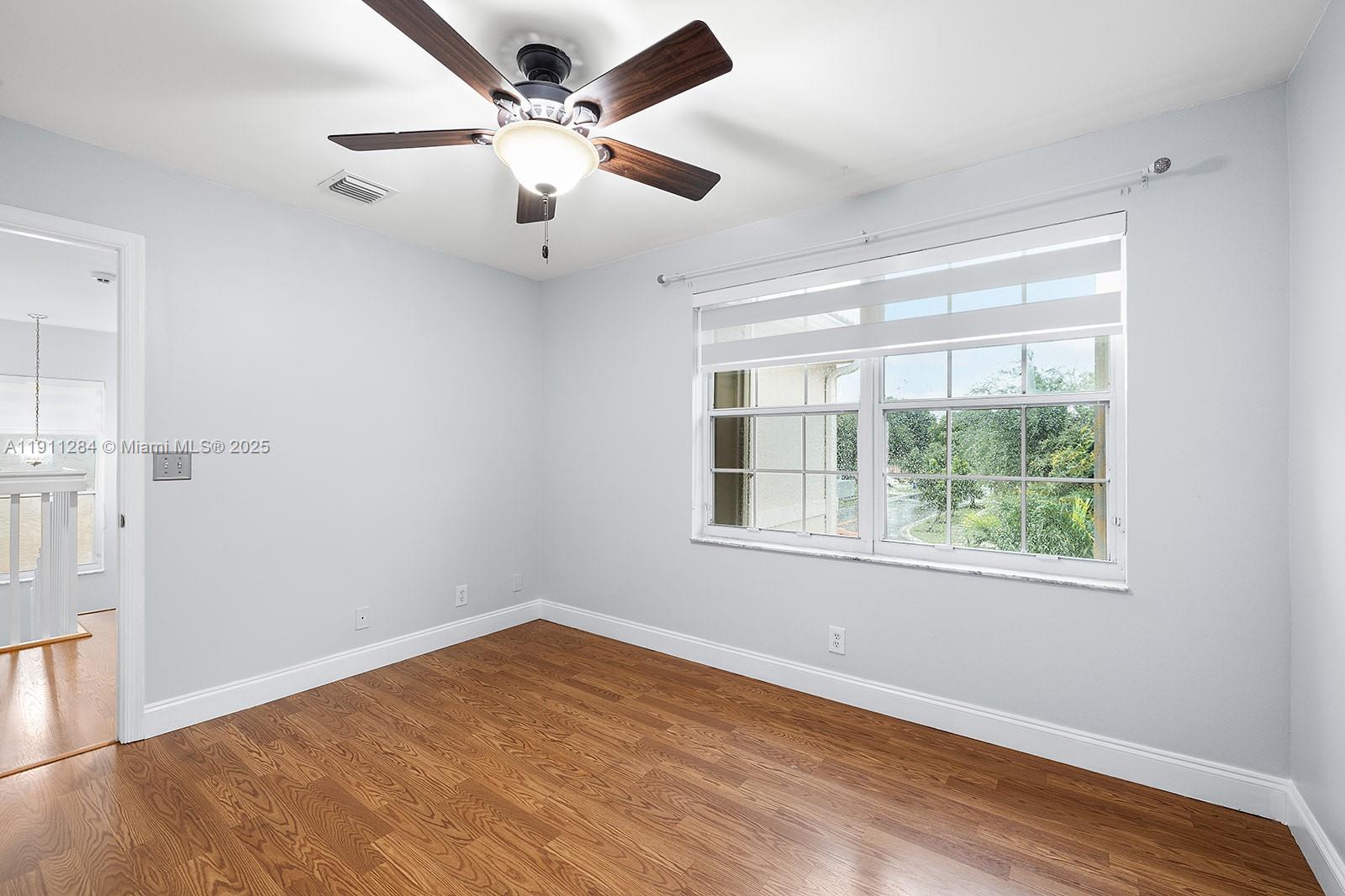 16296 Southwest 26th Street Miramar, FL 33027 - Photo 32 of 48 wooden floor in an empty room with a window