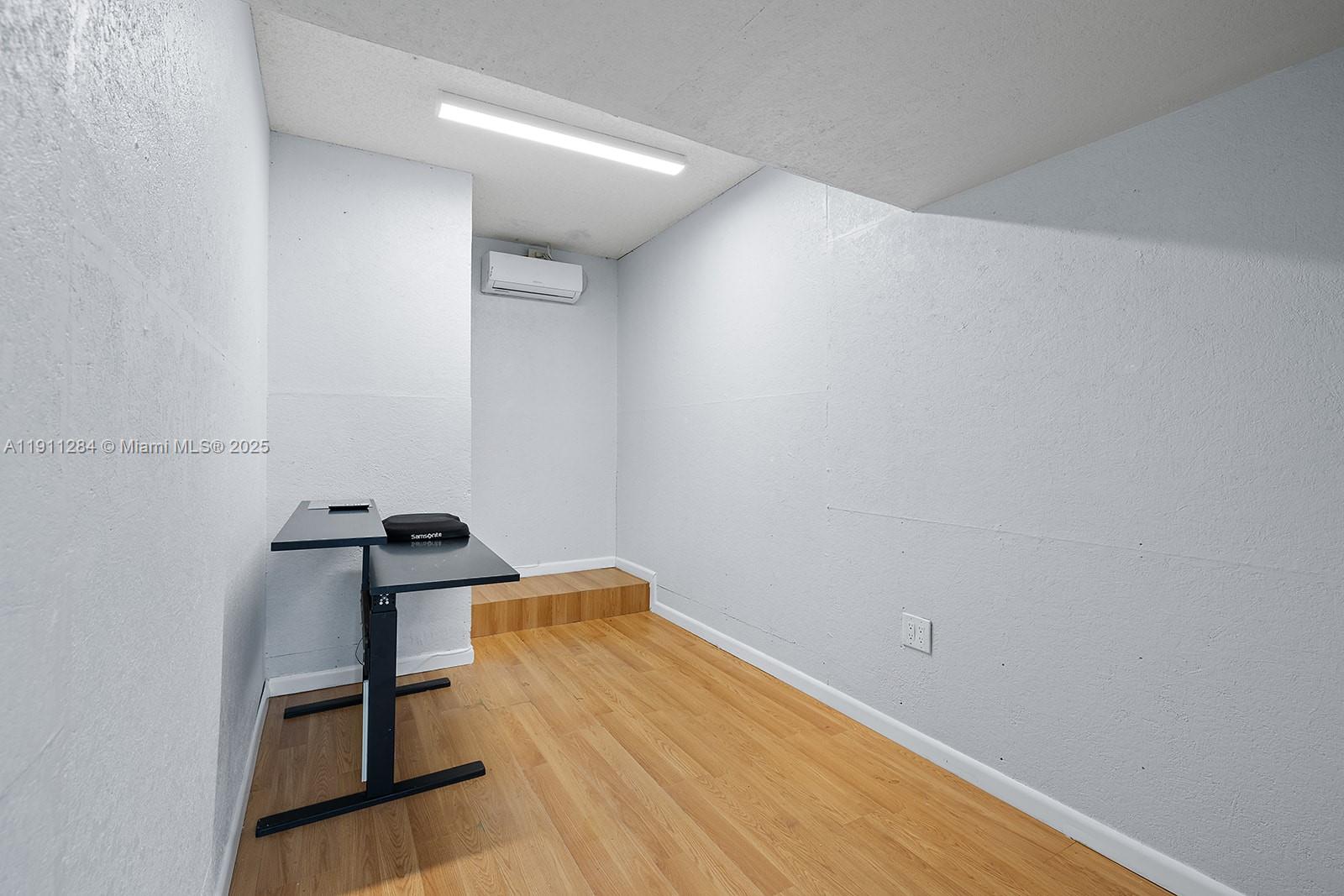 16296 Southwest 26th Street Miramar, FL 33027 - Photo 38 of 48 a view of a room with wooden floor and chairs