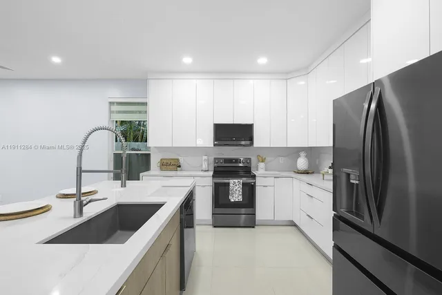 a kitchen with a sink stove and refrigerator