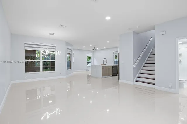 a view of an empty room with stairs